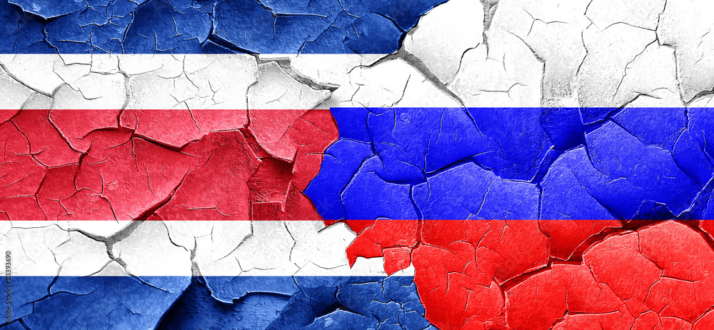 Costa Rica flag with Russia flag on a grunge cracked wall Costa Rica flag with Russia flag on a grunge cracked wall