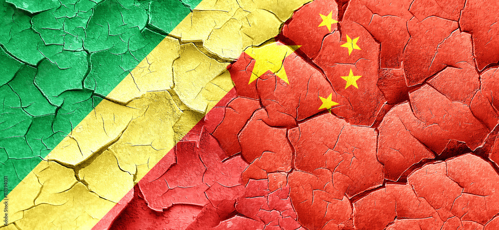Fototapeta premium Congo flag with China flag on a grunge cracked wall