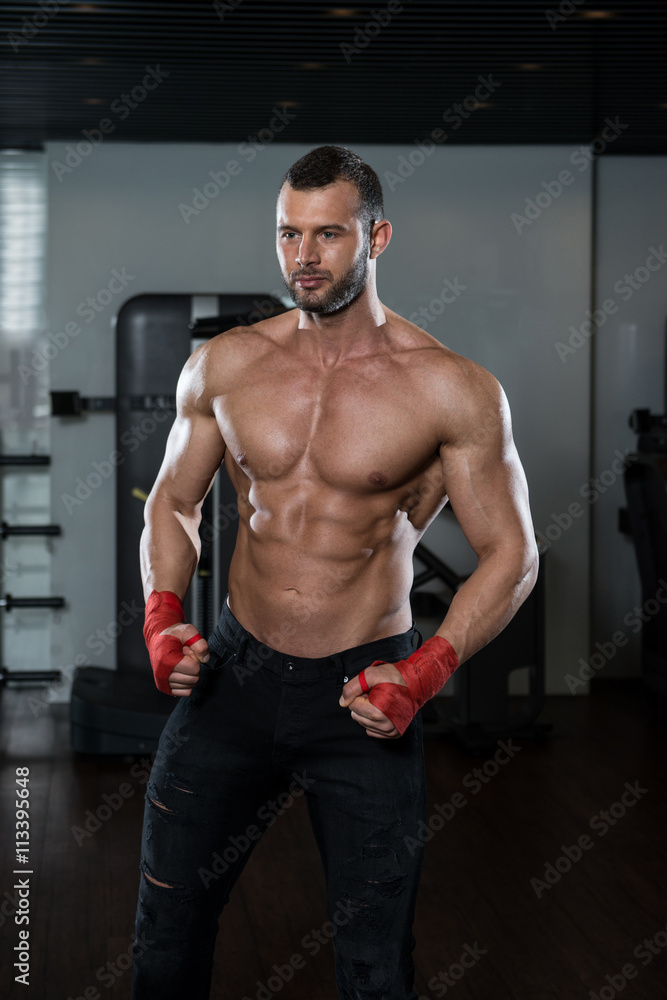 Ripped Young Man In Modern Fitness Center