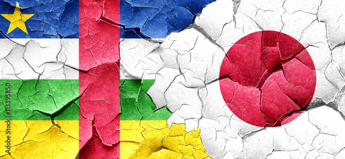 Central african republic flag with Japan flag on a grunge cracke