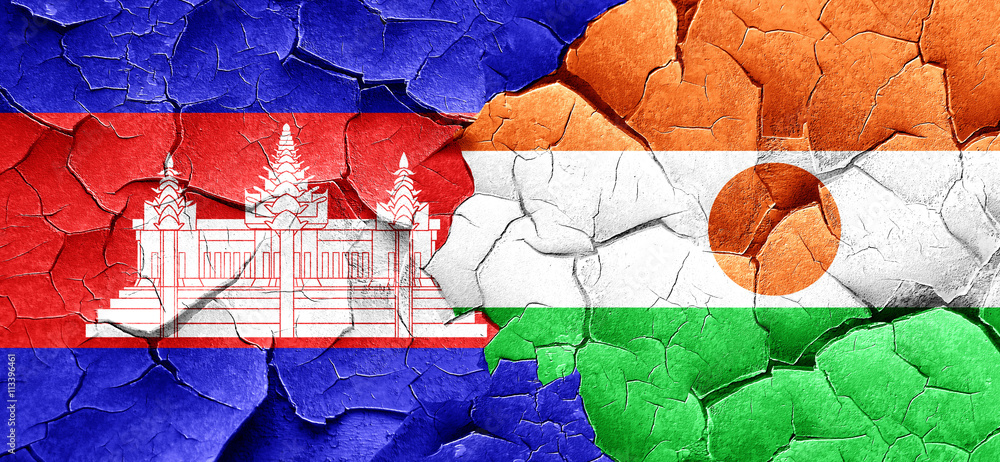 Cambodia flag with Niger flag on a grunge cracked wall