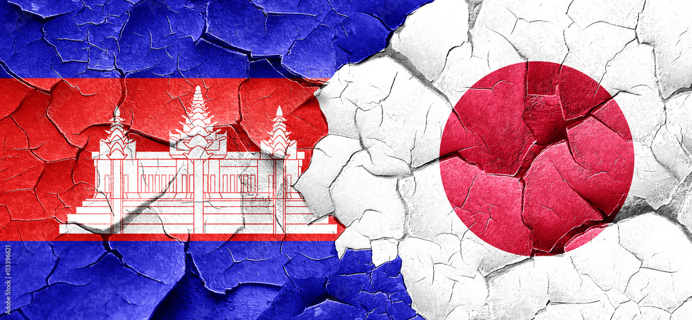 Cambodia flag with Japan flag on a grunge cracked wall