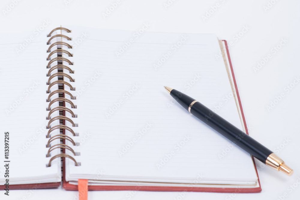 Notebook and pen. Notebook and pen.