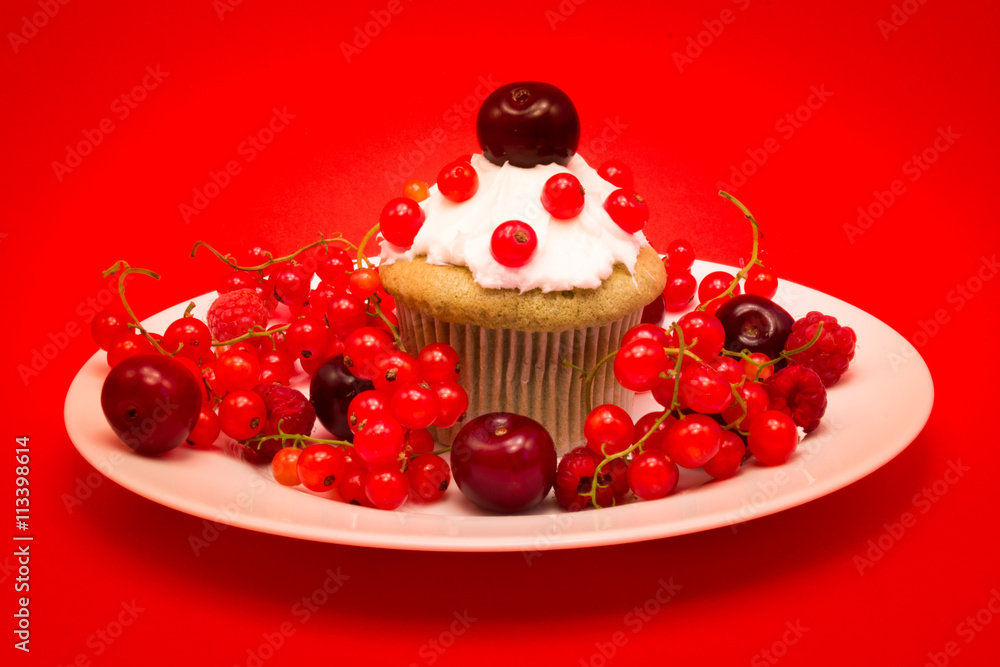 Sweet cupcake with berries and cherries Sweet cupcake with berries and cherries