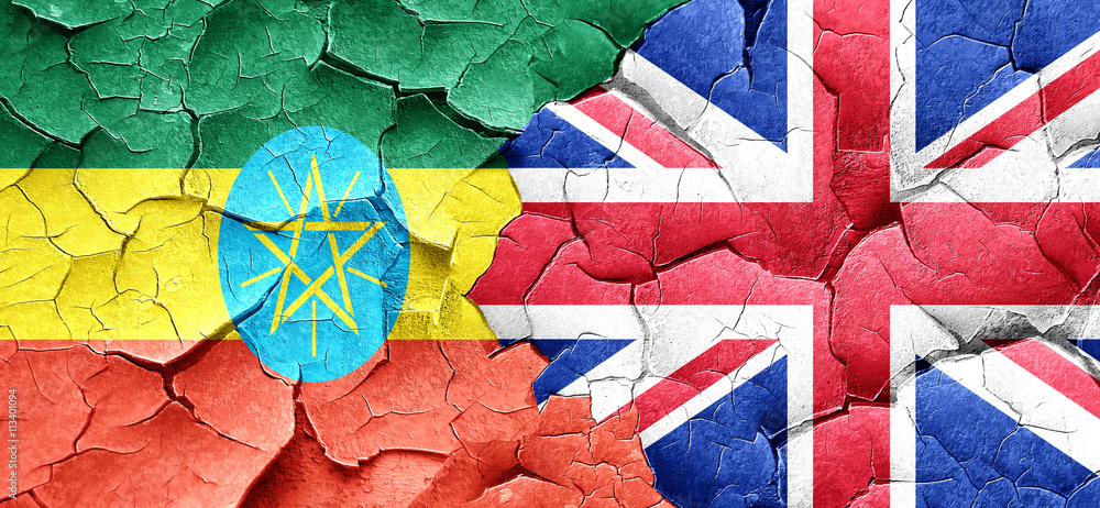 Fototapeta premium Ethiopia flag with Great Britain flag on a grunge cracked wall