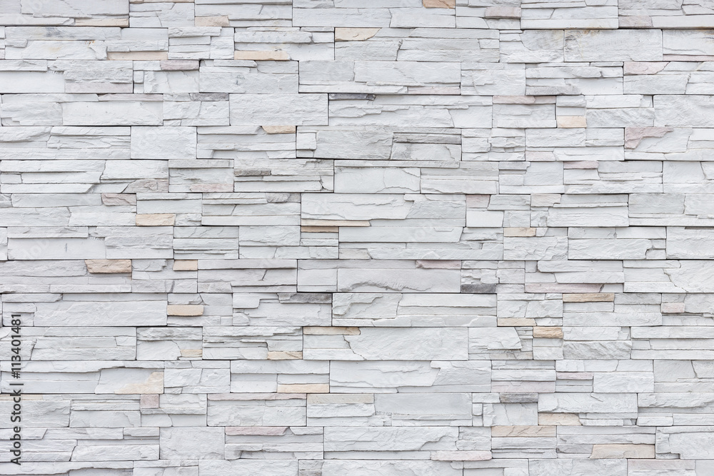 Naklejka premium Pattern of grey and rough sandstone wall texture for background