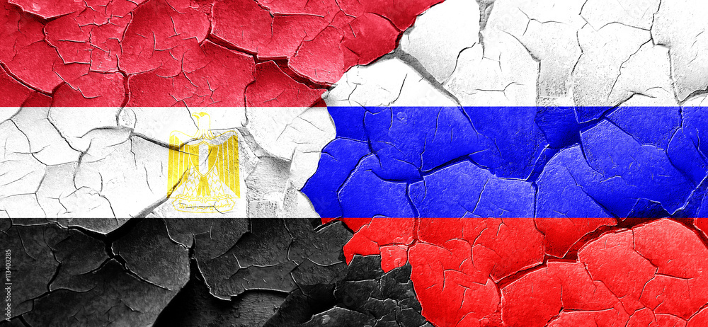 Egypt flag with Russia flag on a grunge cracked wall