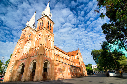 Saigon Notre-Dame Cathedral Basilica (Basilica of Our Lady of The Immaculate Conception) on blue sky background in Ho Chi Minh city, Vietnam. Ho Chi Minh is a popular tourist destination of Asia.