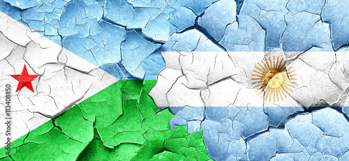Djibouti flag with Argentine flag on a grunge cracked wall
