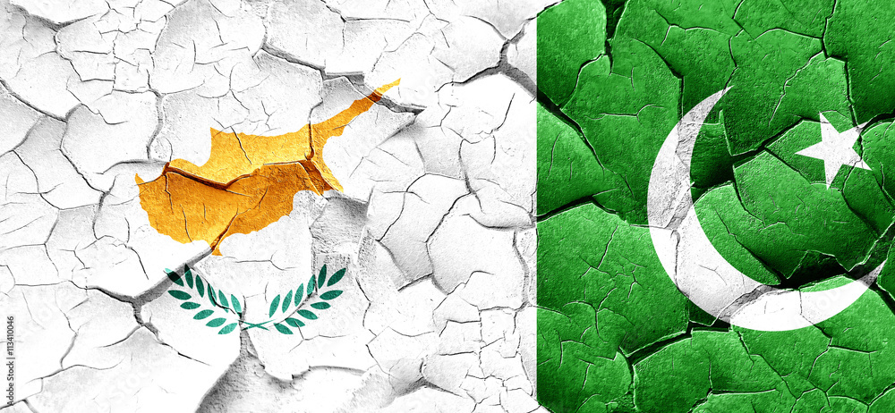 Fototapeta premium Cyprus flag with Pakistan flag on a grunge cracked wall