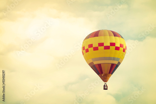 Hot air balloon on sun sky with cloud, vintage and retro filter effect style © jakkapan