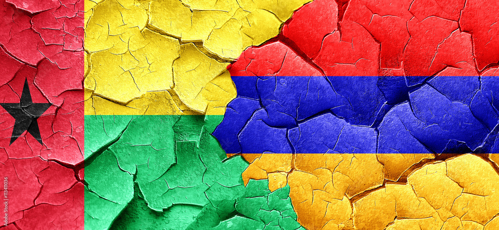 Guinea bissau flag with Armenia flag on a grunge cracked wall