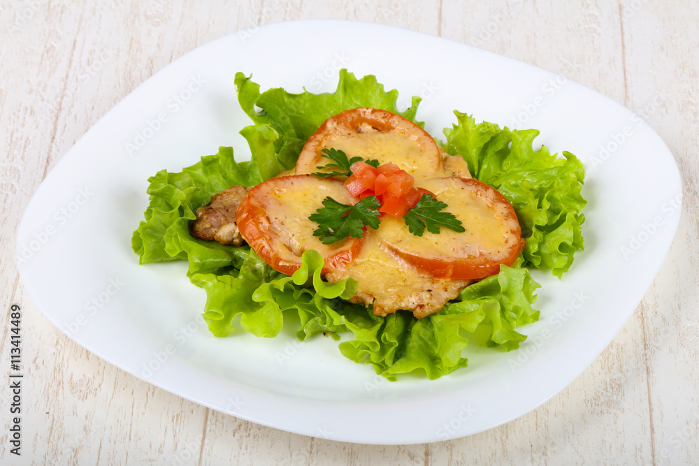 Pork baked with tomato and cheese Pork baked with tomato and cheese