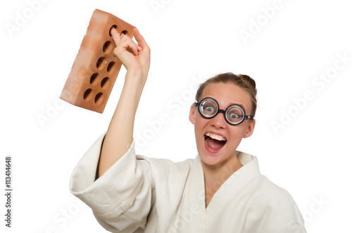 Funny woman in kimono with brick on white