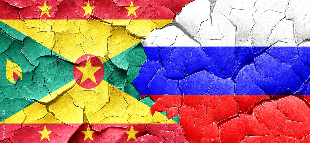 Grenada flag with Russia flag on a grunge cracked wall