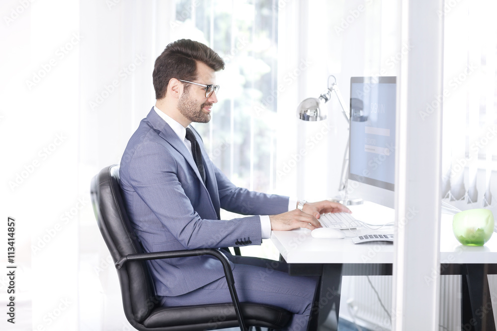 Log in to your computer, Young businessman working at office Log in to your computer, Young businessman working at office