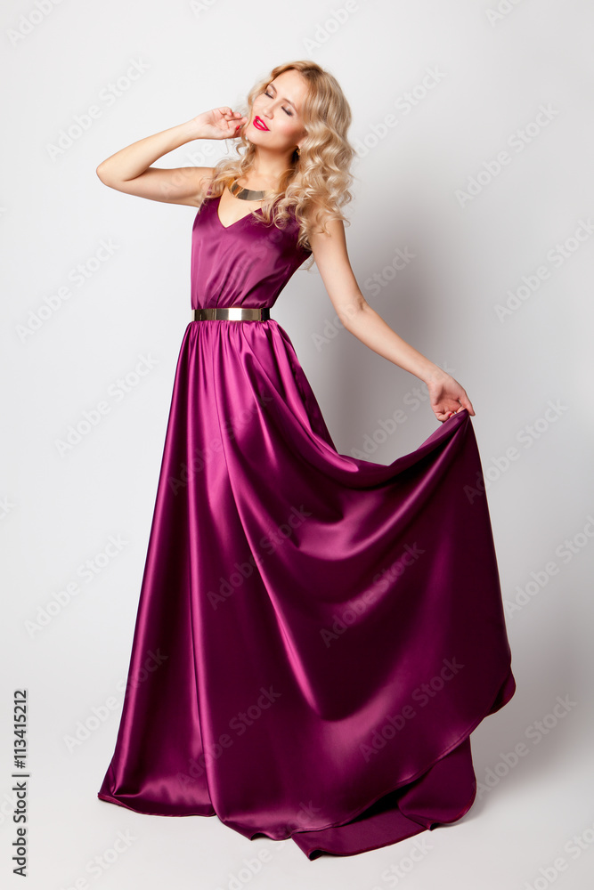 Beautiful woman model posing in elegant dress