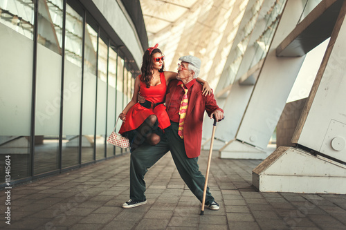 Vászonkép Young girl is dancing with the old man.