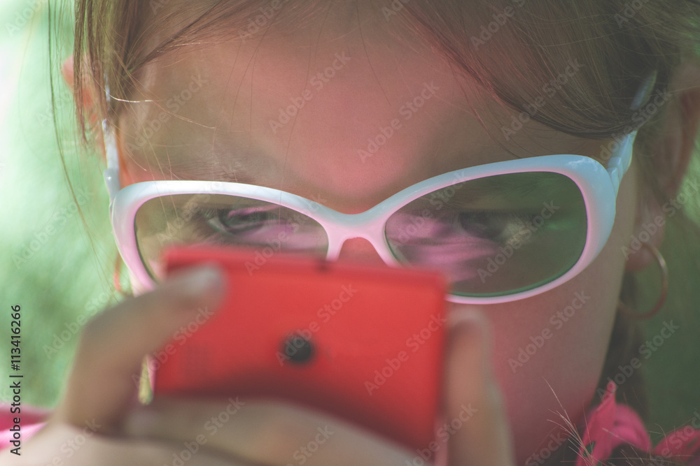Girl looking at smartphone