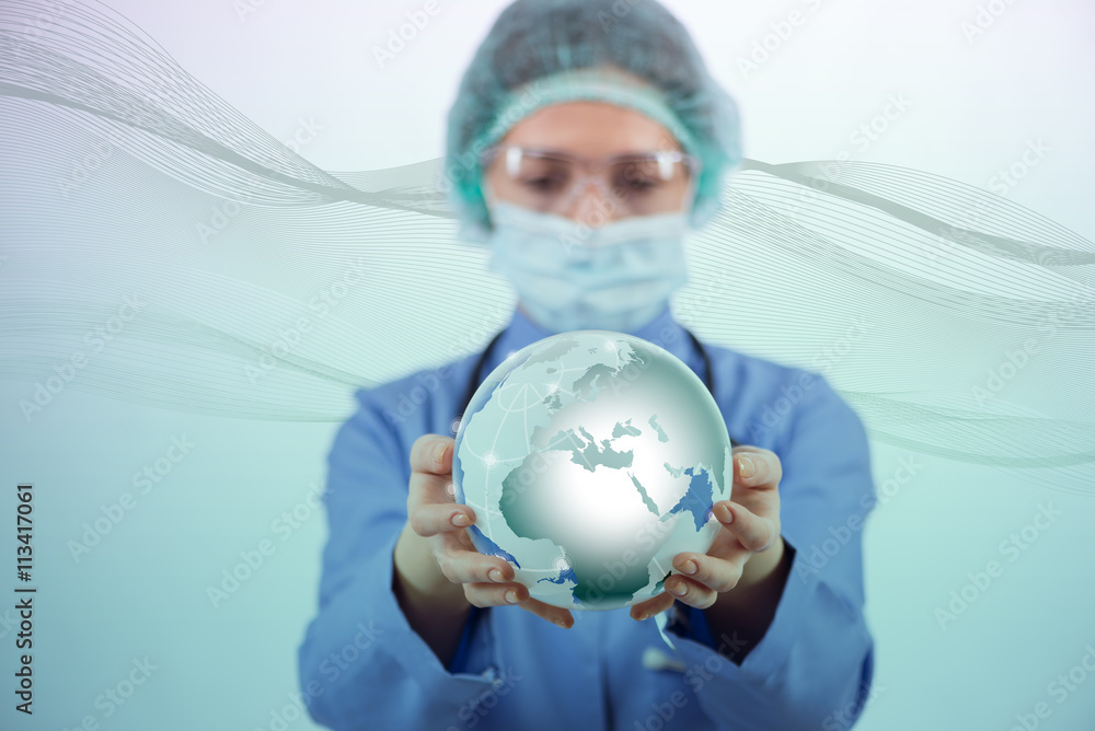 Woman doctor holding earth in globalisation concept Woman doctor holding earth in globalisation concept