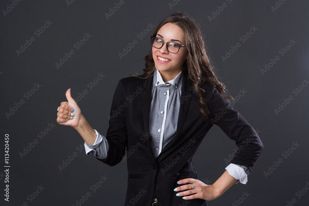 beautiful smiling girl holding thumb up beautiful smiling girl holding thumb up
