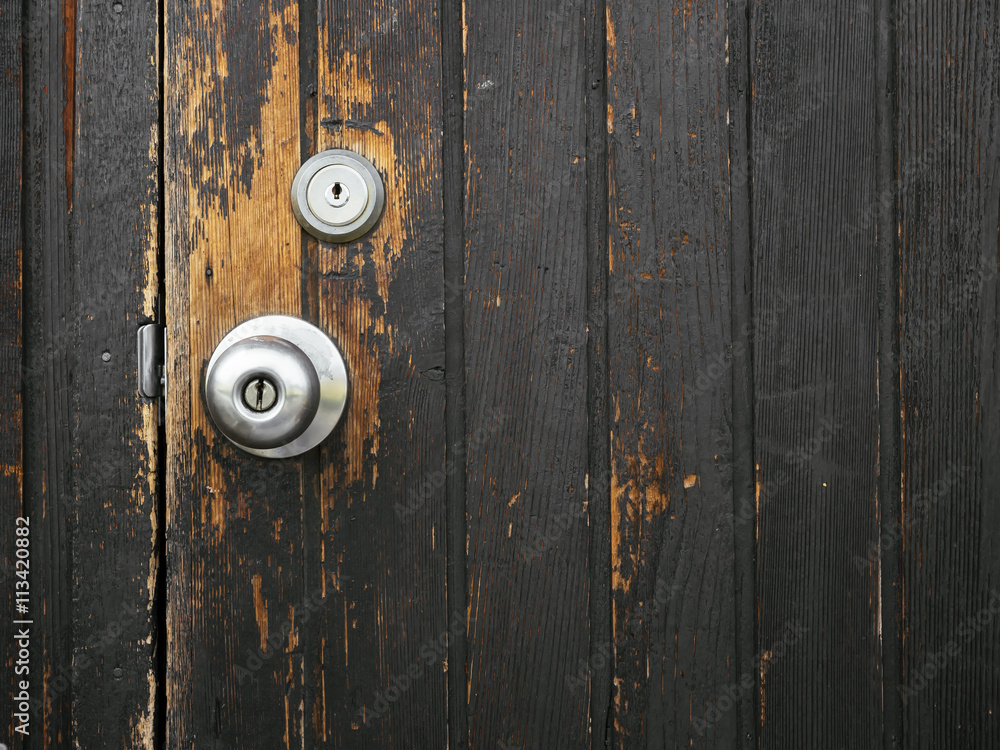 Old door knob on Wooden door Textured Old door knob on Wooden door Textured