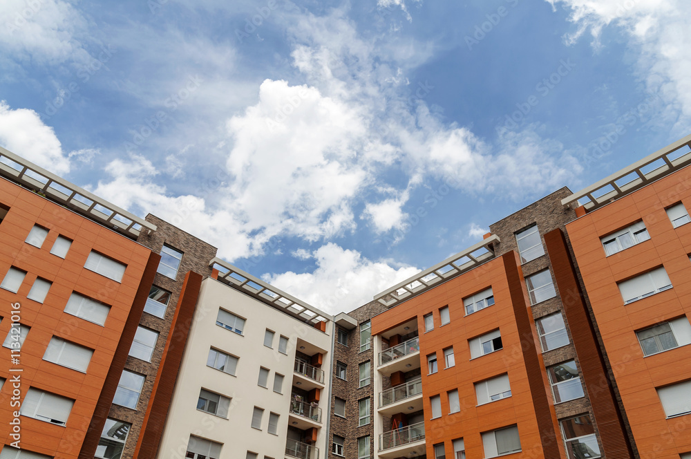 New block of modern apartments and blue sky New block of modern apartments and blue sky