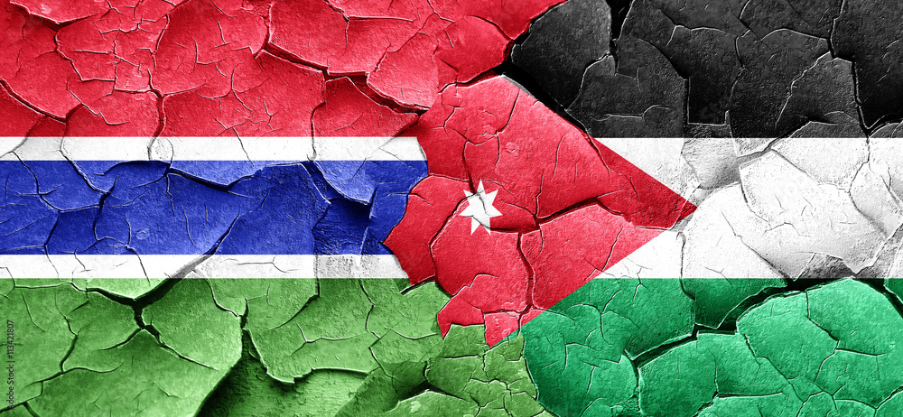 Gambia flag with Jordan flag on a grunge cracked wall Gambia flag with Jordan flag on a grunge cracked wall