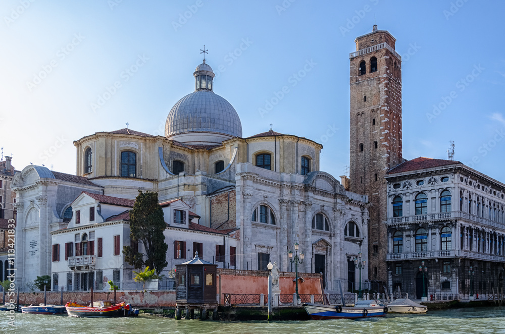Old church with tower on the venetian street, Venice