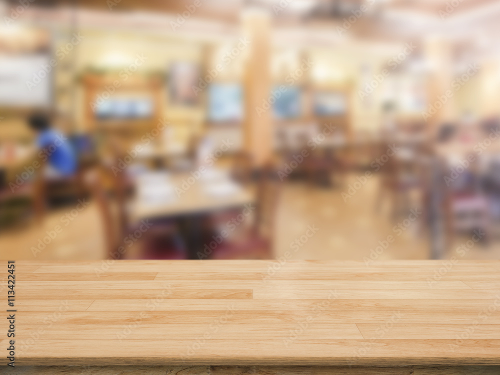 wooden counter top with restaurant blurred background