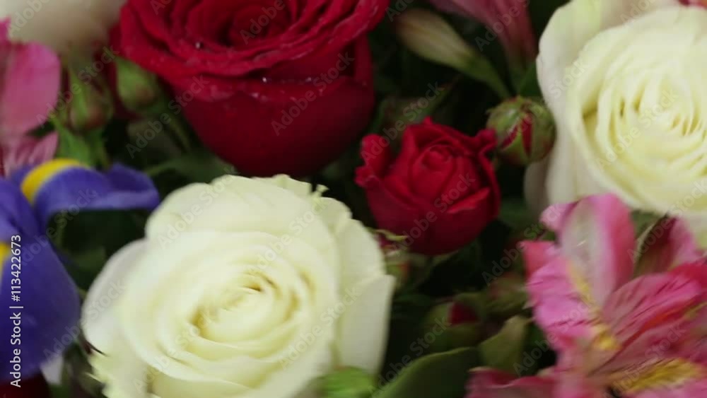 Beautiful bouquet roses, iris and alstroemeria quickly rotating. Beautiful bouquet roses, iris and alstroemeria quickly rotating.