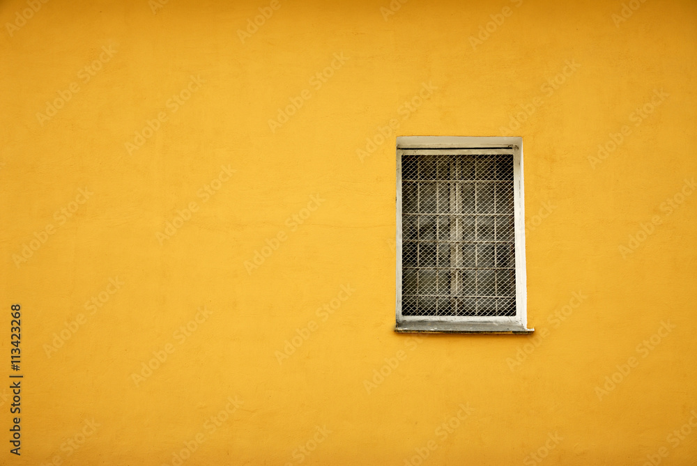 Window in yellow wall Window in yellow wall