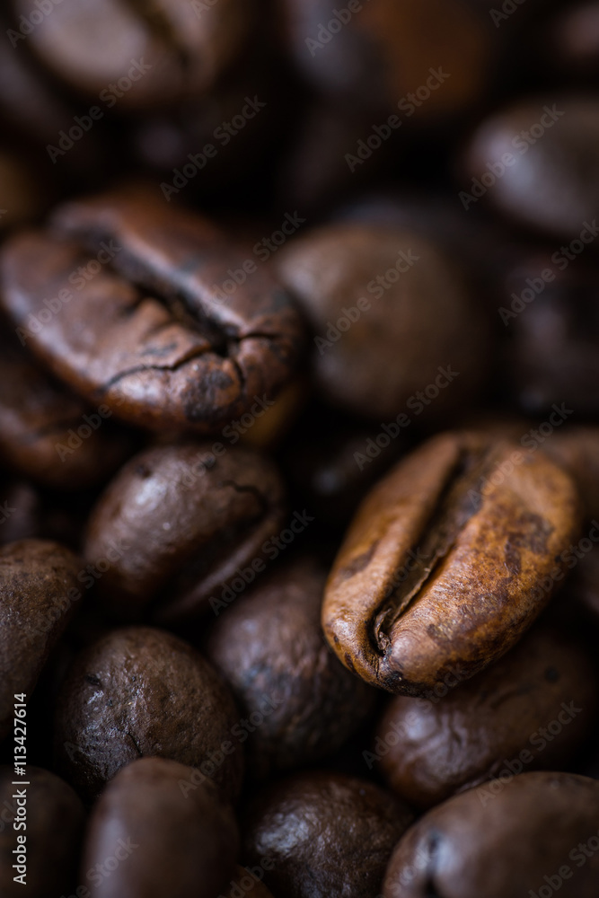 Macro view of roasted coffee beans. Detail shot of coffee beans with selective focus. Shallow depth of field. Macro view of roasted coffee beans. Detail shot of coffee beans with selective focus. Shallow depth of field.
