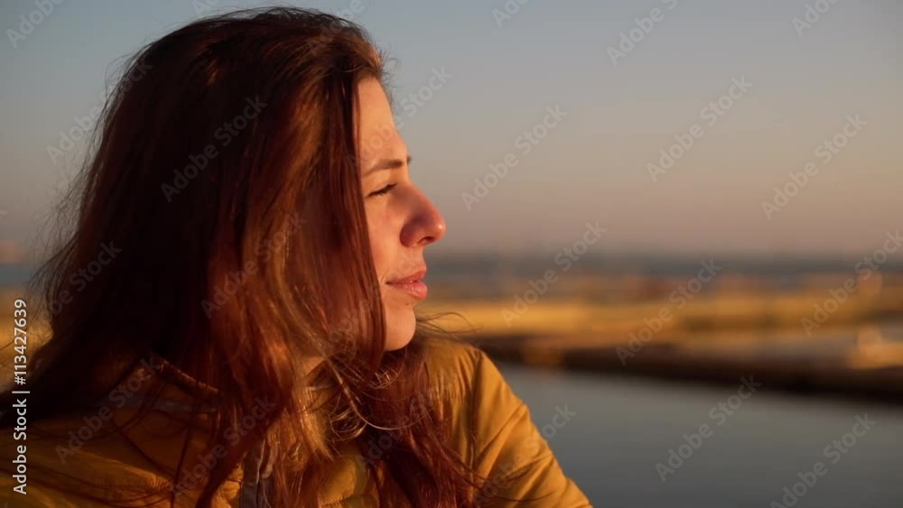 Young beautiful girl near sea. Close up. Slow motion. Young beautiful girl near sea. Close up. Slow motion.
