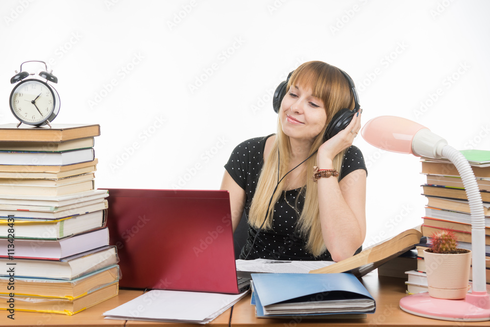 After hearing the student an interesting music on headphones After hearing the student an interesting music on headphones