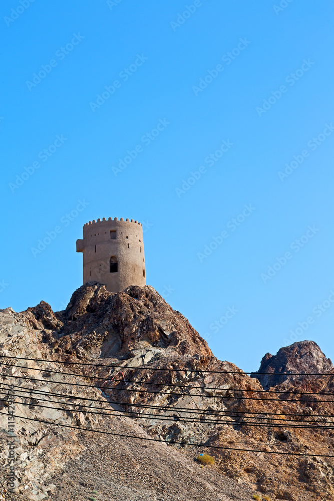 in oman muscat rock  the old defensive  fort battlesment sky and