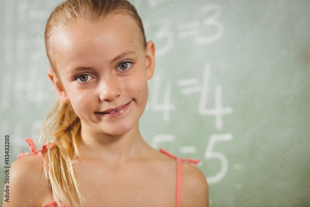 Girl standing in front of blackboard Girl standing in front of blackboard