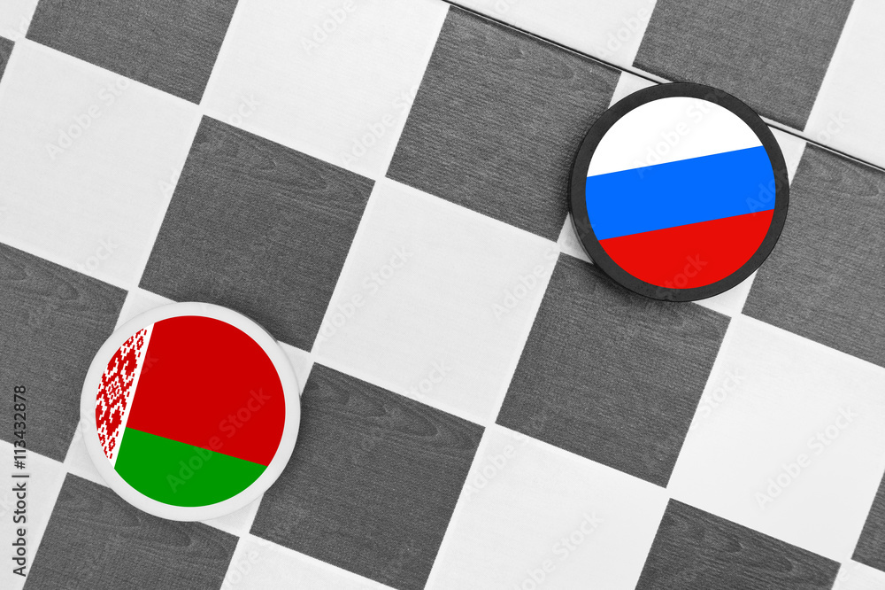 Naklejka premium Draughts (Checkers) - Russia vs Belarus - russian sphere of influence - west / east heading of belarusian country and partnership, diplomacy, confrontation and hybrid war
