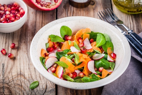 Salad with corn lettuce, radish, carrot, pomegranate and mint