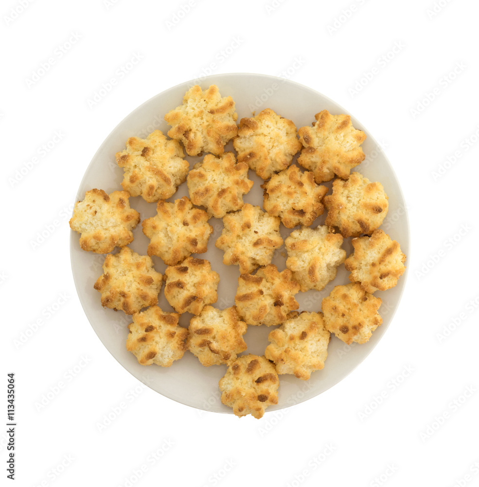 Top view of a plate of sugar free coconut macaroons isolated on a white background. Top view of a plate of sugar free coconut macaroons isolated on a white background.