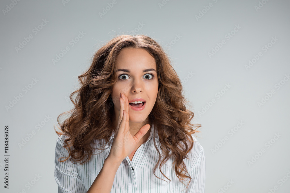Portrait of young woman with shocked facial expression Portrait of young woman with shocked facial expression