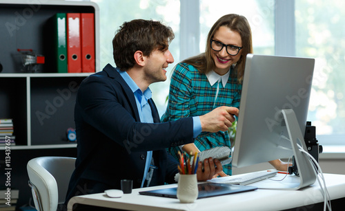 Young colleague - man and woman working from home - modern busin