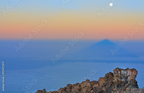 Landscape with stones, shadow of Teide and moon