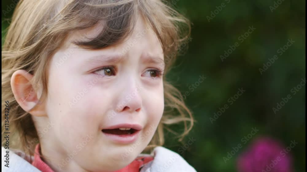 Portrait of a sad and crying curly little girl Portrait of a sad and crying curly little girl