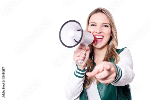 Canvas Print Smiling young woman holding megaphone