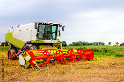 Closeup of a colorful combine parked after finishing the work