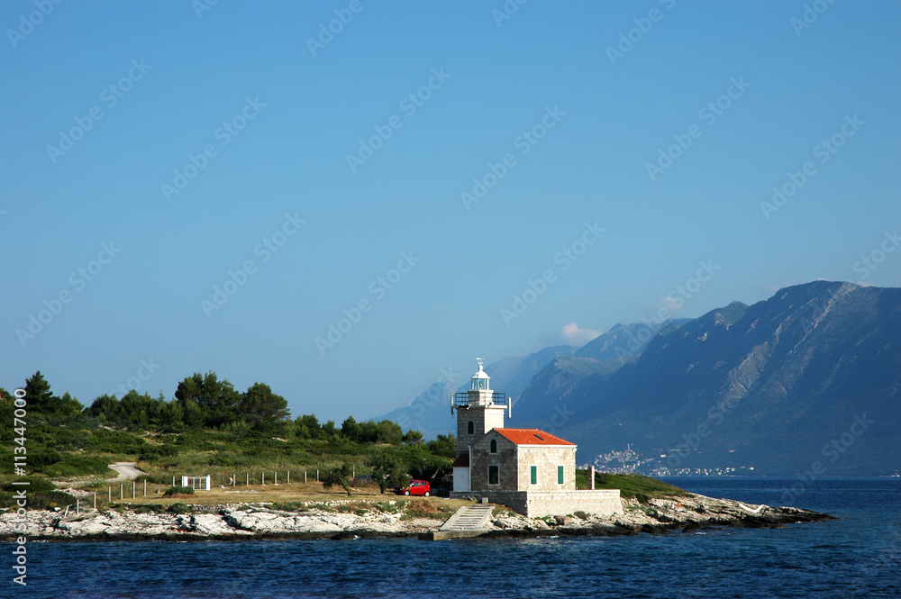 Seascape and lighthouse on the coast near Hvar island, Croatia