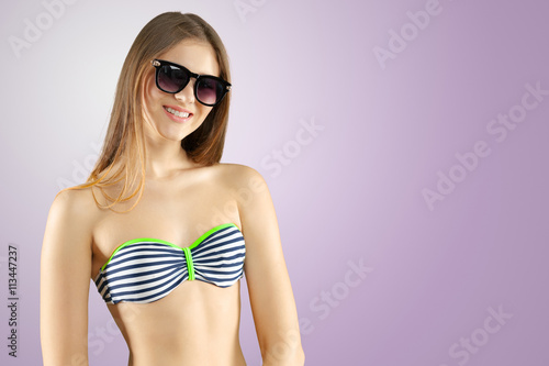 Blonde girl in striped bikini
