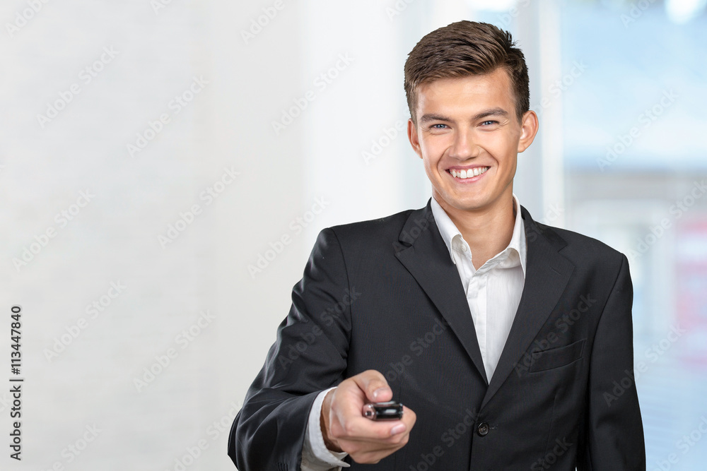 Young smiling man holding car keys Young smiling man holding car keys
