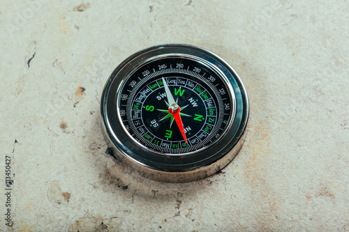 Compass on a gray gradient background